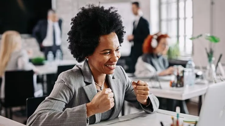 African business colleagues working at a computer in an office — how to make a website load faster in Nigeria