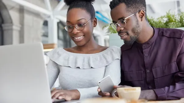 Business colleagues in a meeting on a laptop in an office — how to prepare for a website development project