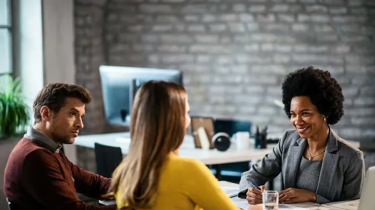 African couple in a meeting in an office — how to protect your app idea in Nigeria