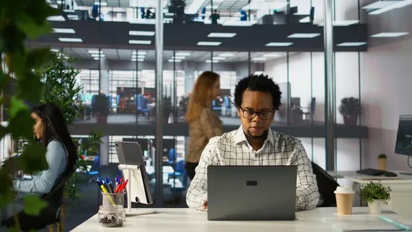 A manager working in an office — how to protect your business website from hackers