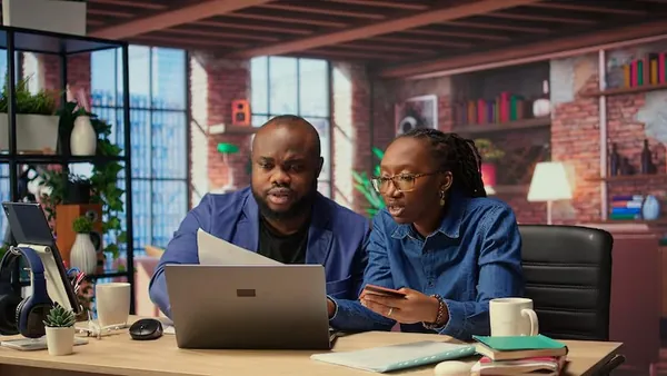 Business colleagues working in an office — how to rank products on Google Nigeria