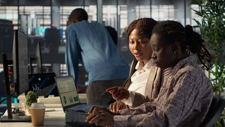 African business colleagues working in an office — how to scale a business in Nigeria