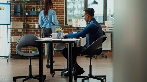 An African businessman reviewing over documents in an office — how to track website leads in Nigeria
