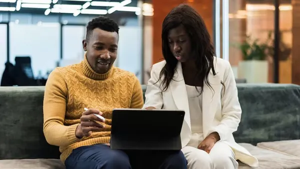 An African businesswoman working with a tablet in an office — how to turn a website into a web app