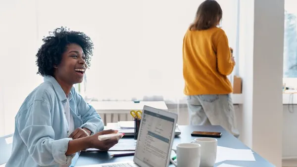 Business colleagues working in an office — an article about HR software for Nigerian businesses