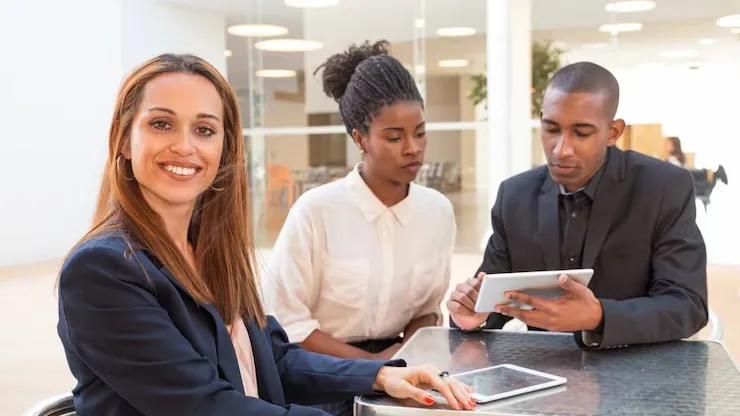 Business colleagues at work in an office — an article about legal CRM software in Nigeria