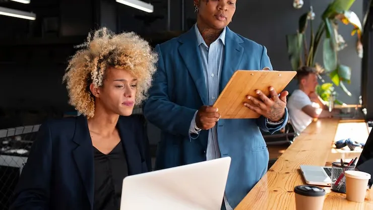 Business colleagues working in an office — an article about logistics automation in Nigeria