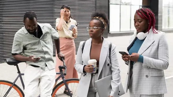 Business colleagues working in an office — an article about marketplace development cost Nigeria