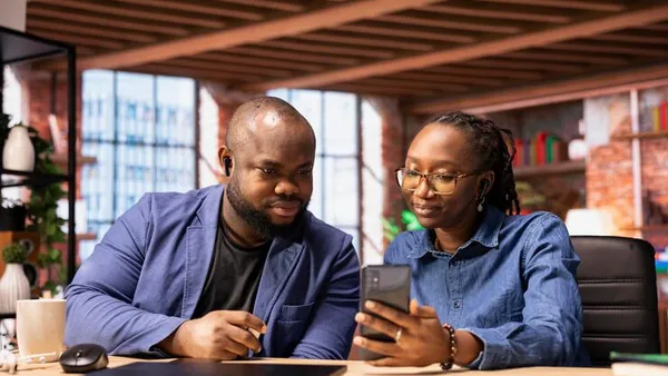 Business colleagues in a meeting in an office — an article about multi-vendor app development in Nigeria
