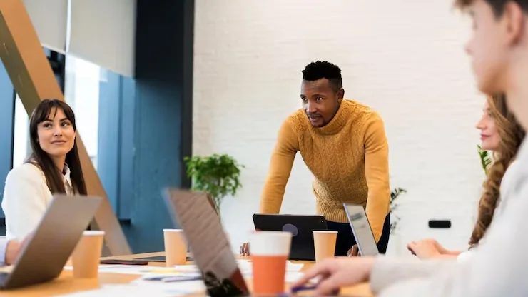 African business colleagues in a meeting in an office — an article about Next.js vs WordPress
