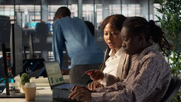 African business colleagues working in an office — an article about online business ideas in Abuja