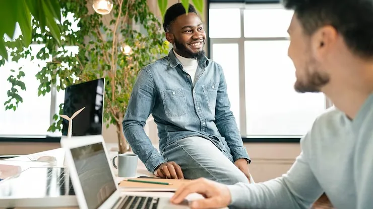 Business colleagues in a meeting in an office — an article about payroll software for Nigerian businesses