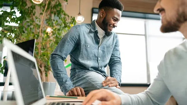 Business colleagues in a meeting in an office — an article about React Native app development in Nigeria