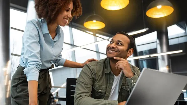Business colleagues working in an office — an article about responsive website design explained