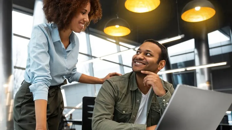 Business colleagues working in an office — an article about responsive website design explained