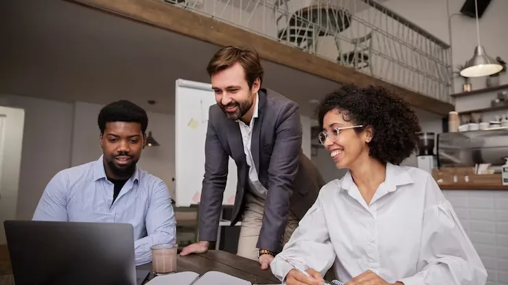 Business colleagues working in an office — an article about restaurant management software in Nigeria