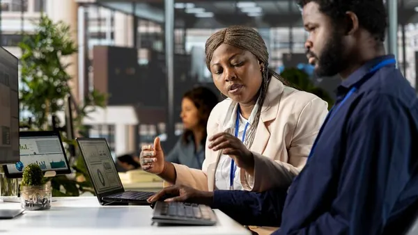 African business colleagues planning in an office — an article about SaaS business ideas for Nigeria