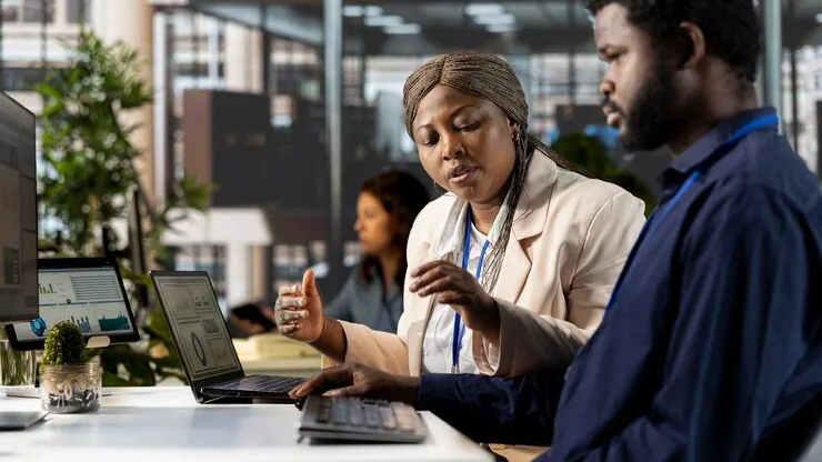 African business colleagues planning in an office — an article about SaaS business ideas for Nigeria