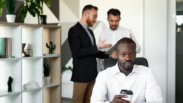An African businessman working in an office — an article about SaaS development in Nigeria