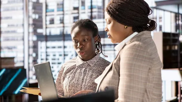 African business colleagues working in an office — an article about sales KPIs for Nigerian businesses