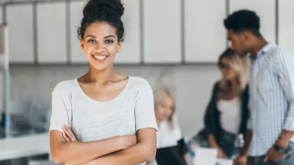 African business colleagues at work in an office — an article about school website design in Nigeria