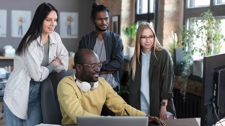 Business colleagues working in an office — an article about SEO-friendly website design Nigeria