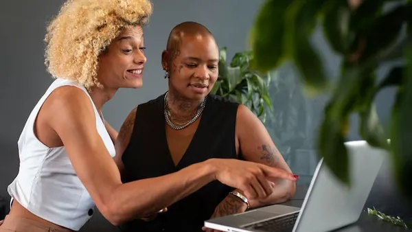 Business colleagues working in an office — an article about software development checklist