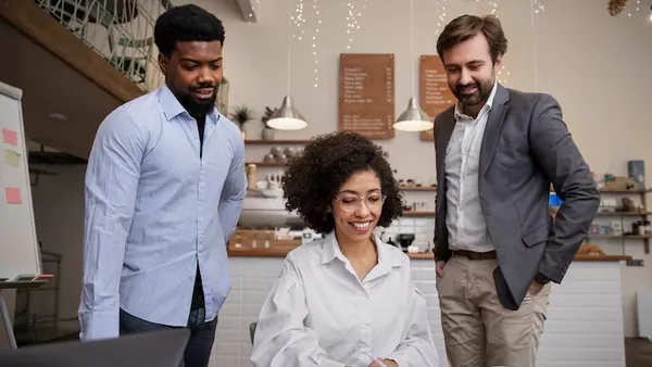Business colleagues working in an office — an article about technology solutions for Nigerian accounting firms