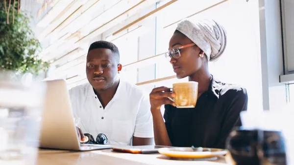 African business colleagues working in an office — an article about technology solutions for Nigerian event companies