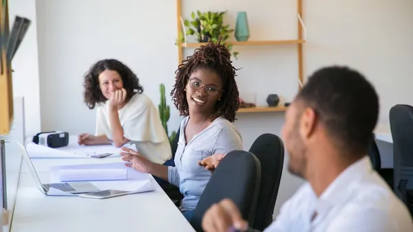 Business colleagues working in an office — an article about technology solutions for Nigerian healthcare startups