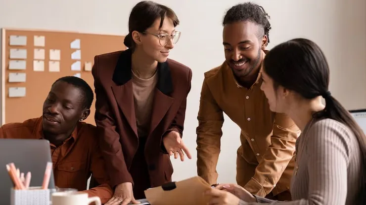 Business colleagues working in an office — an article about technology solutions for Nigerian manufacturing