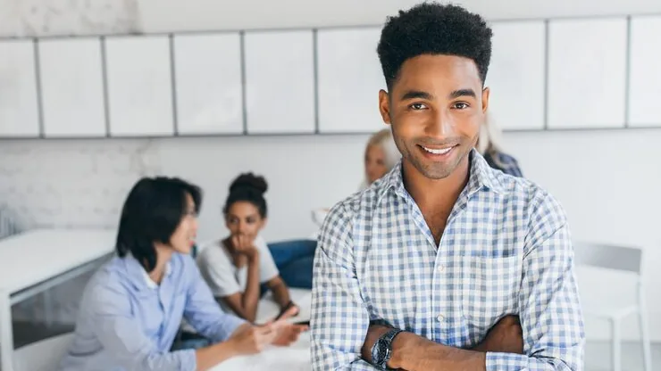 African business colleagues in a meeting in an office — an article about technology solutions for Nigerian professional