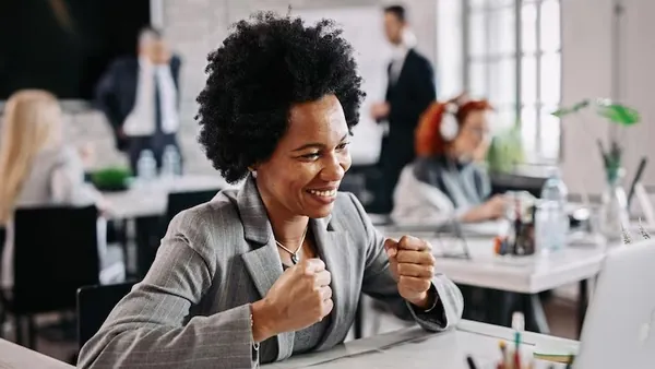 African business colleagues working at a computer in an office — an article about website design for Nigerian accountants