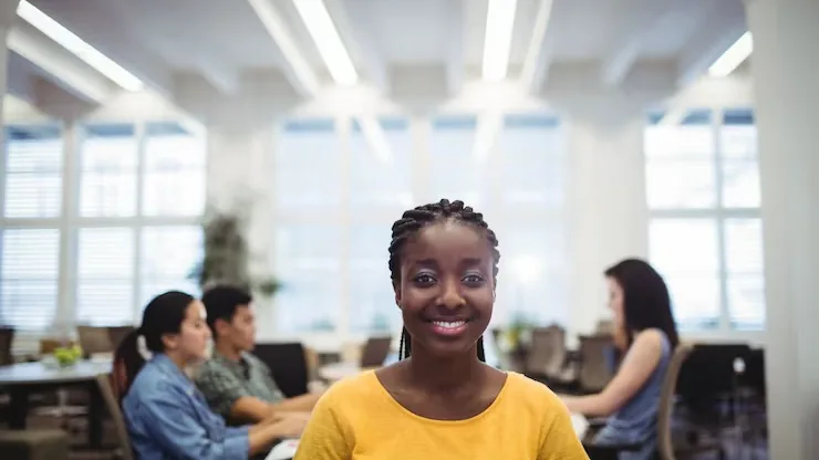 Business colleagues working in an office — an article about website design for Nigerian coaches
