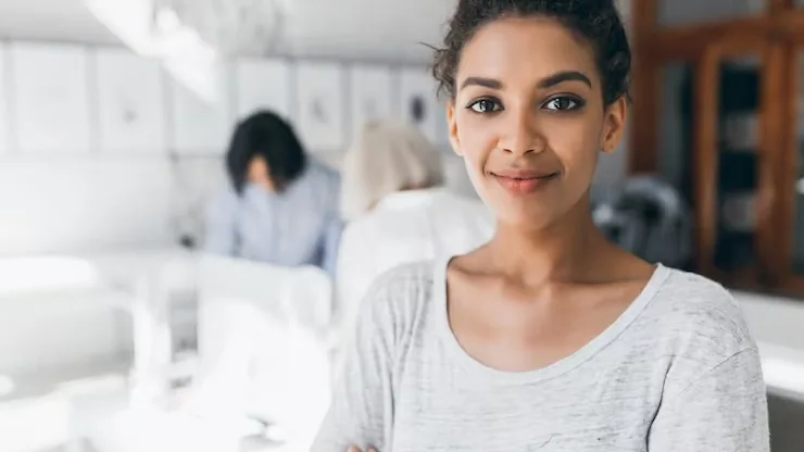 African business colleagues at work in an office — an article about website design for Nigerian engineers