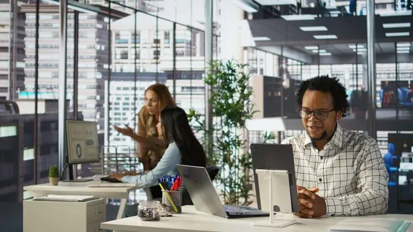 An African businessman working in an office — an article about website development Enugu
