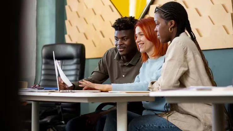 Business colleagues working in an office — an article about website development for Nigerian agricultural businesses