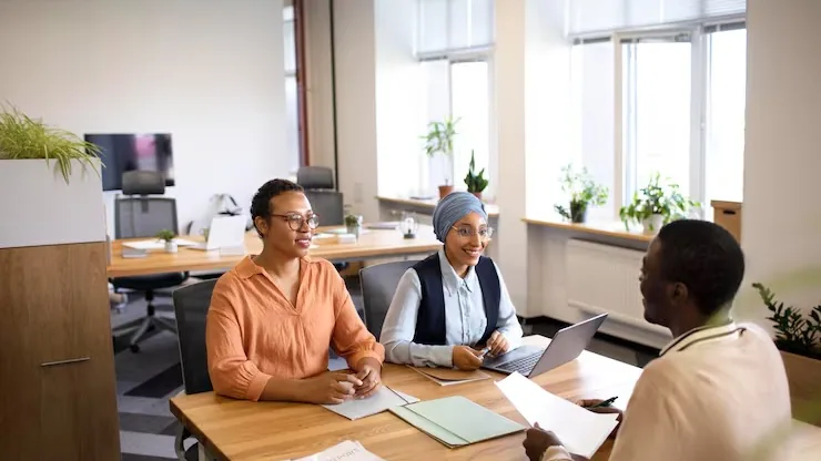 A businessman in a meeting in an office — an article about website development for cleaning companies in Nigeria