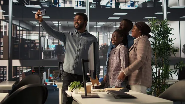 African business colleagues taking notes in an office — an article about website development for manufacturers in Nigeria