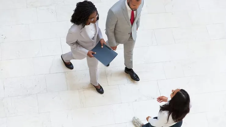 Business colleagues in a meeting in an office — an article about recruitment agency website Nigeria