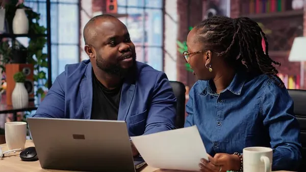 African business colleagues at home — an article about website development process in Nigeria