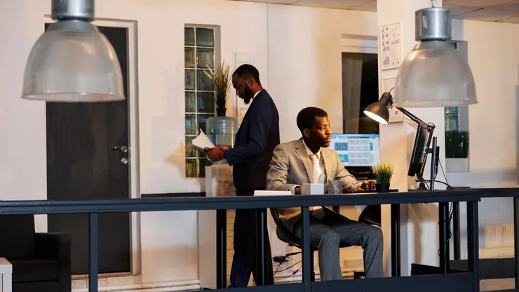 An African businessman reviewing over documents in an office — what does a ₦1 million website get you in Nigeria