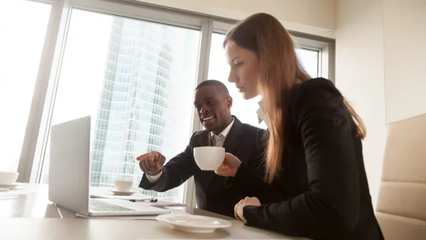 African business colleagues working in an office — an article about Nigerian technology agency