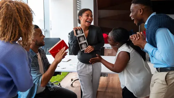Business colleagues working in an office — when to automate your business
