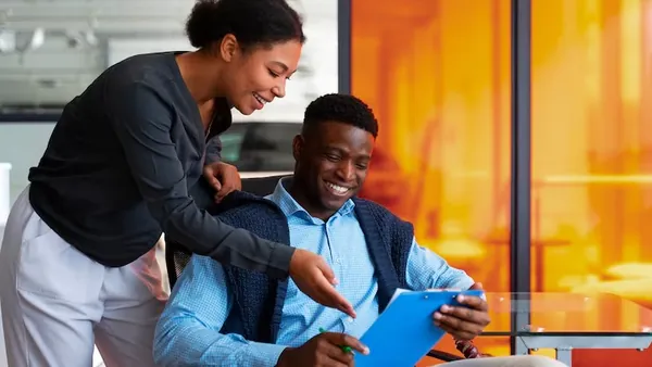 Business colleagues working in an office — when to build custom software