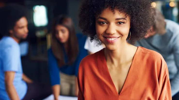 An African businesswoman in a meeting in an office — an article about who owns custom software code